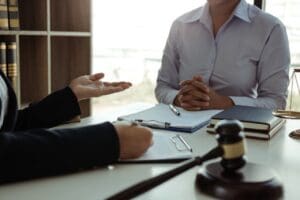 A Guide to Medical Bills & Compensation in North Carolina Personal Injury Claims - Payne Law Firm Lawyer is giving advice to clients who have consulted about legal issues regarding rights infringement.