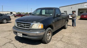 Charlotte Hit and Run Accident Lawyer - Payne Law Firm Ford F-150 pickup truck with Texas license plate at vehicle lot