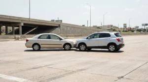 Charlotte Hit and Run Accident Lawyer - Payne Law Firm SUV rear-ending sedan on urban road near highway overpass